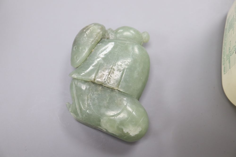 Four Chinese hardstone carvings, one of a gent, a cup and two balls